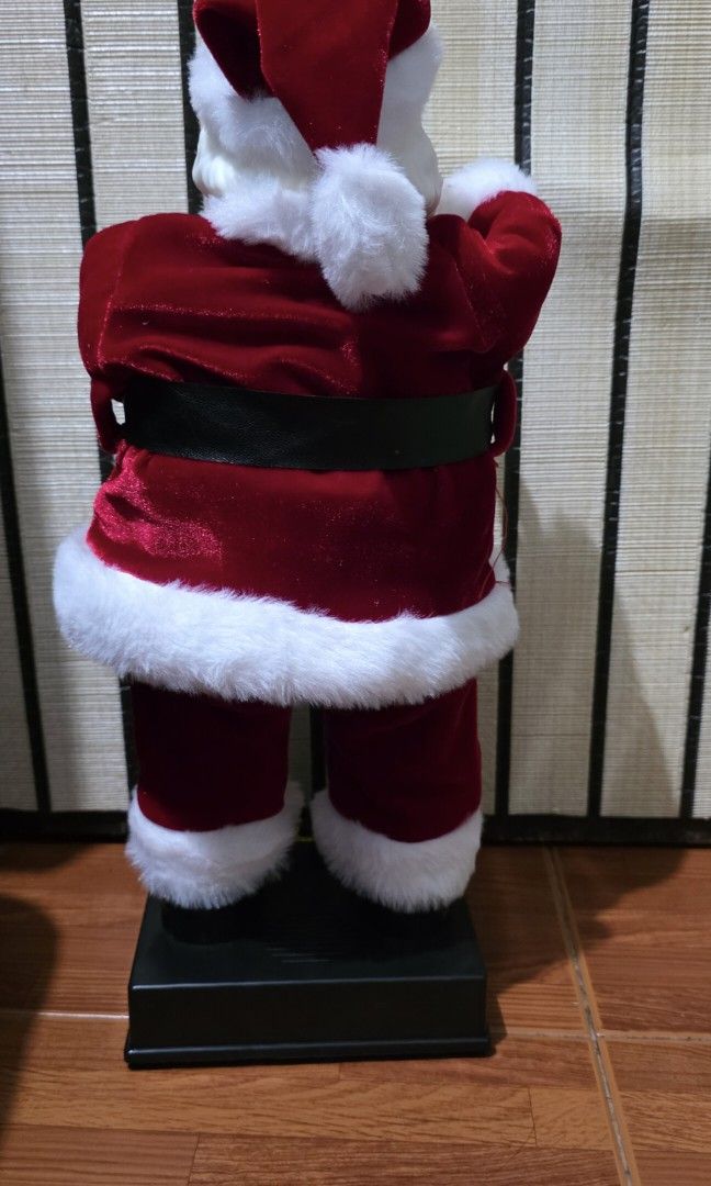 25th Ave. Santa Claus (Category: Other Home Decor) located in Pasig City. Submitted by temerity_16 (Listing ID 1459990244, Image 3). Description: Height- 40 cm / 15.75 inches Not working sounds and not moving anymore (defective) Not displayed or used. Just stored in the box for a year.
