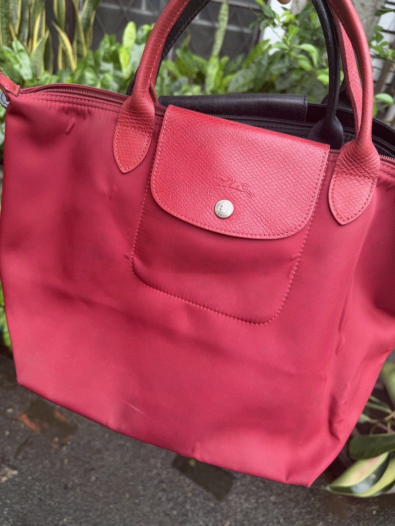 2 Bags- Le Pliage Longchamp bag (Category: Tote Bags) located in Quezon City. Submitted by ks_closet_cleaning (Listing ID 1460065807, Image 2). Description: Price is for 2 bags Small le pliage- 1 red and 1 black Red- purchased in Paris Black- purchased in London Guaranteed Authentic Price for 2 bags Can still be used for lunch box, tote dump all bags Stored and forgotten- has some foldings/ bubbles due to storage.