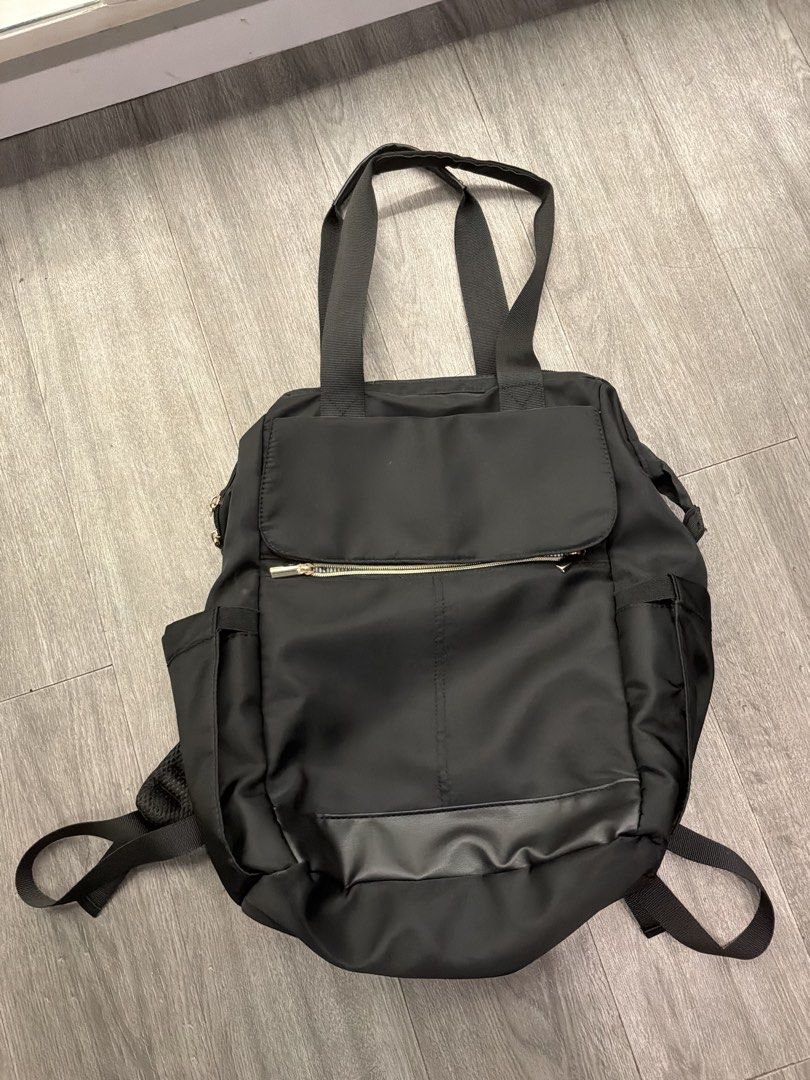 2-Way Laptop Bag (Unbranded, Multi-Compartments) (Category: Tote Bags) located in Marikina City. Submitted by glimmr.ph (Listing ID 1460003948, Image 1). Description: Used once. Leather is not cracked but with dents. Bought in Japan. Has up to 10 pockets: - Laptop compartment - Internal zipper pocket - 3 small pockets inside - Zip pocket outside - Clasp pocket outside - Secret pocket at the back - 2 side pockets for umbrellas or tumblers.