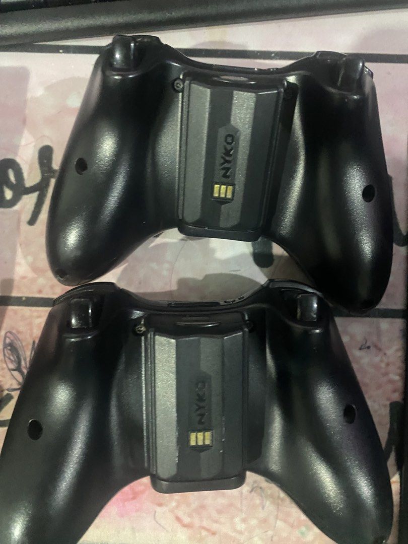 4Xbox 360 Wireless Controllers, Nyko Charge Base, and Cooler (Category: Xbox) located in Manila. Submitted by miavill (Listing ID 1459915398, Image 3). Description: - Two (4)Black Xbox 360 Wireless Controllers - Nyko Dual Controller Charging Base - Two (2) Rechargeable Battery Packs for Controllers - Xbox 360 Console Cooling Fan Attachment - All items are black - Ideal for extended gaming sessions and multiplayer.