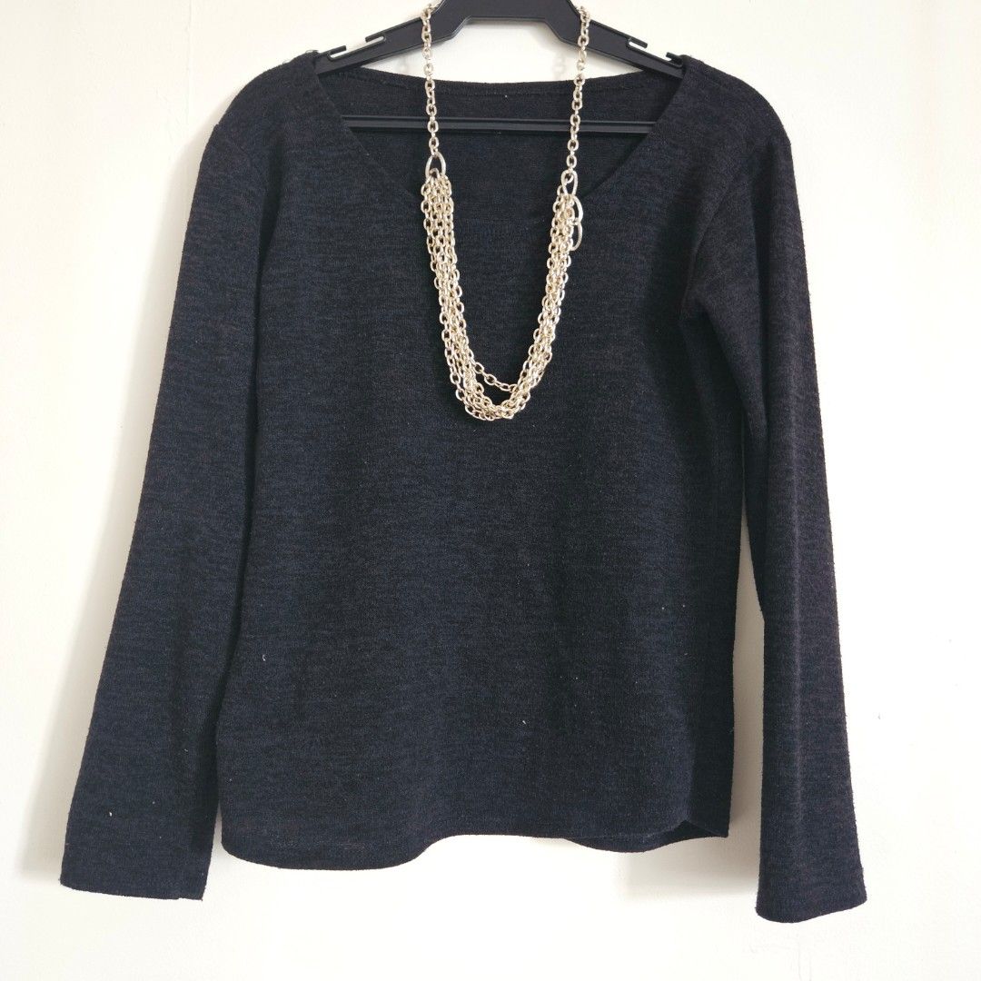 56. Black Long Sleeve Sweater Free Size (Category: Longsleeves) located in San Juan City. Submitted by titaofmanilaessentials (Listing ID 1459998084, Image 1). Description: - Dark grey long sleeve sweater - Unique silver chain detail around the neckline - Soft knit material - Great for layering or wearing on its own - Versatile wardrobe piece - Used once for US trip.