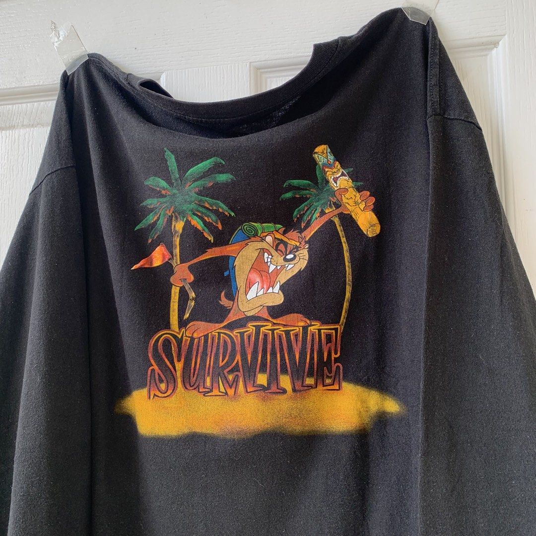 90’S TAZMANIAN DEVIL ‘SURVIVOR’ (Category: Tshirts & Polo Shirts ) located in Plaridel. Submitted by sonofthe.dawgg (Listing ID 1460001008, Image 1). Description: - 26 x 27 MEASUREMENT (BOXY XL) - MISSING LOONEY TUNES TAG - LOOSE STITCHING.
