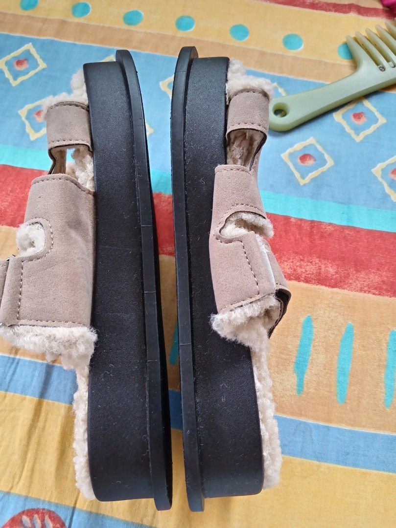 🩴 Cozy Fuzzy Two-Strap Slides — Size 39 (Category: Flats & Sandals) located in Davao. Submitted by mizzycat62 (Listing ID 1459975545, Image 1). Description: - Beige sandals with a super soft fluffy lining. - Features an adjustable strap at the front for a secure fit. - Stylish thick black sole for comfort and durability. - Size 39. - Ideal for everyday casual wear..