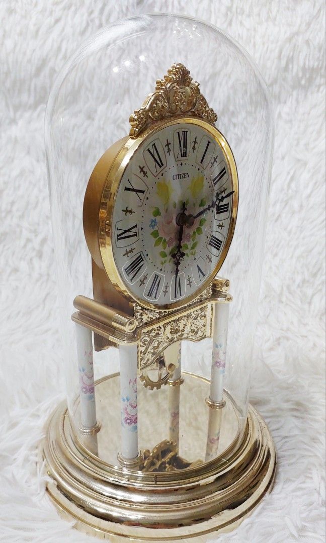 ✨ Ornate Citizen Quartz Mantel Clock ✨ (Category: Clocks) located in Binan City. Submitted by sakuratreasuresph (Listing ID 1459934103, Image 3). Description: ✨ Ornate Citizen Quartz Mantel Clock ✨ Add a touch of timeless charm to your space with this beautiful Citizen quartz mantel clock. Featuring an intricate gold-tone ornamental design, classic Roman numeral dial, floral accents, and a clear glass dome that beautifully showcases the clock’s d