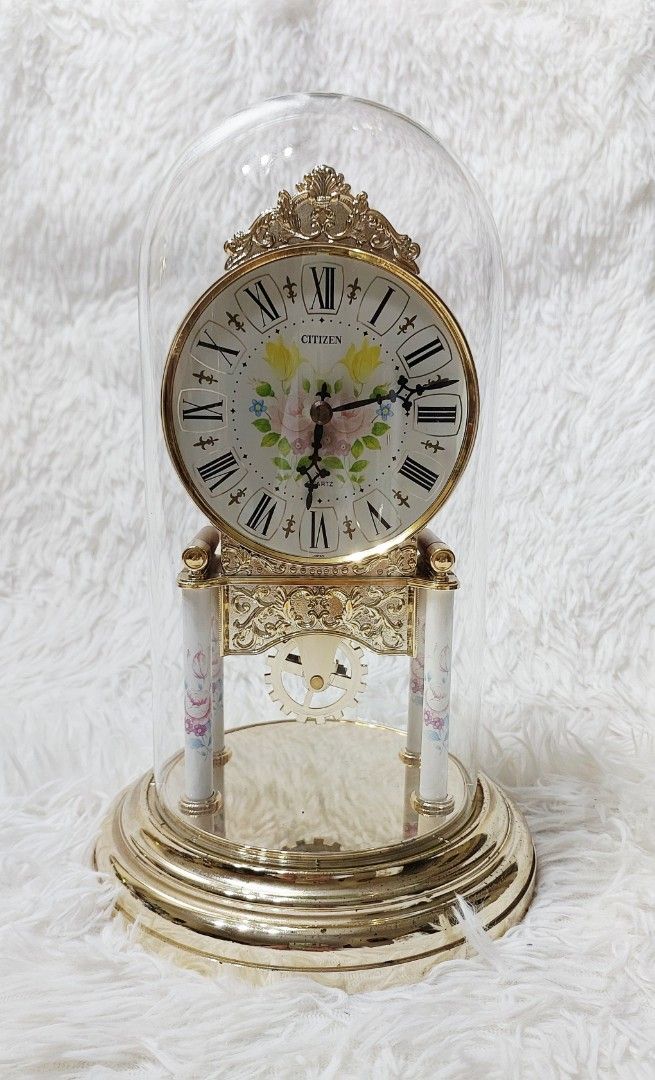 ✨ Ornate Citizen Quartz Mantel Clock ✨ (Category: Clocks) located in Binan City. Submitted by sakuratreasuresph (Listing ID 1459934103, Image 2). Description: ✨ Ornate Citizen Quartz Mantel Clock ✨ Add a touch of timeless charm to your space with this beautiful Citizen quartz mantel clock. Featuring an intricate gold-tone ornamental design, classic Roman numeral dial, floral accents, and a clear glass dome that beautifully showcases the clock’s d