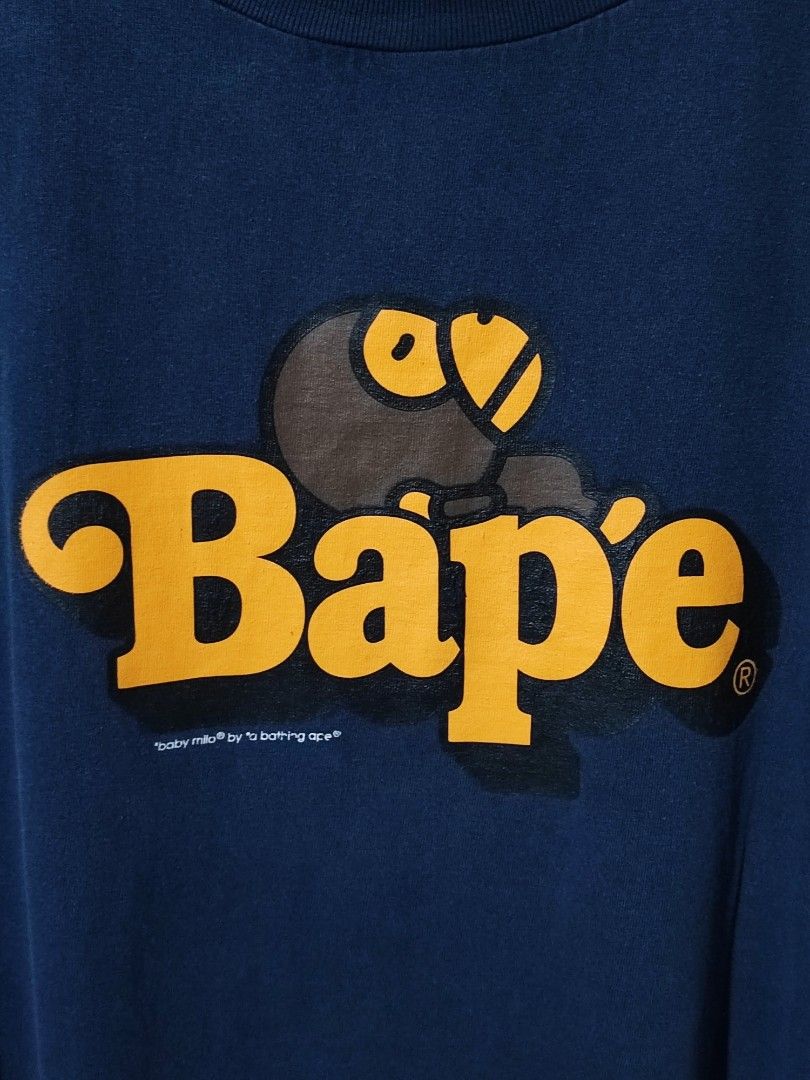 A BATHING APE - MILO ON BAPE TEE (Category: Tshirts & Polo Shirts ) located in Iloilo. Submitted by gooddimes (Listing ID 1460095455, Image 2). Description: A Bathing Ape - Milo On Bape Tee Authentic Navy Blue color Size on tag: XL Dimes: 25Wx29.5L Issue/s: Hairline Crack Print (Check Last 2 Pics) Color rate: 8.8/10 Used condition ₱1,200 Reminders: - All items are thrifted, please manage your expectations - Color may vary due to lighting - Please