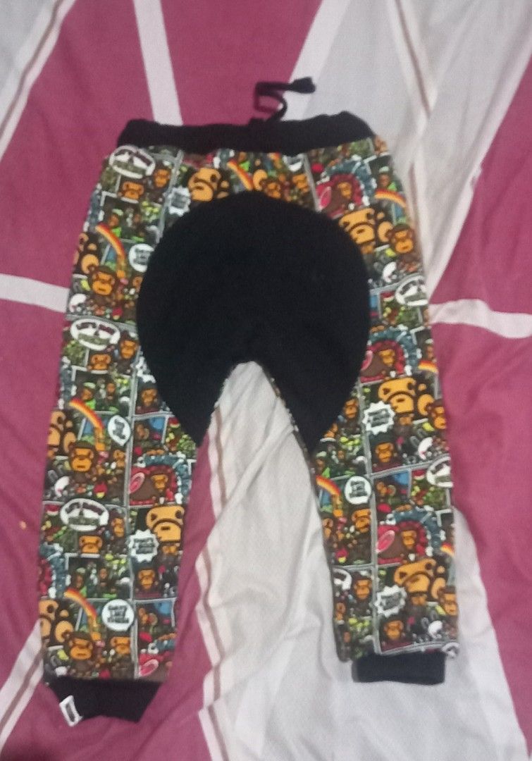 A Bathing Ape Kids BAPE STA Monkey Camo Jogger Pants (Category: Babies & Kids Fashion) located in San Pablo. Submitted by lheyab (Listing ID 1459961002, Image 3). Description: - Iconic BAPE KIDS monkey camo print - Comfortable black waistband and cuffs - Adjustable drawstring for a perfect fit - Soft black and white striped lining - Ideal for everyday wear and active play.