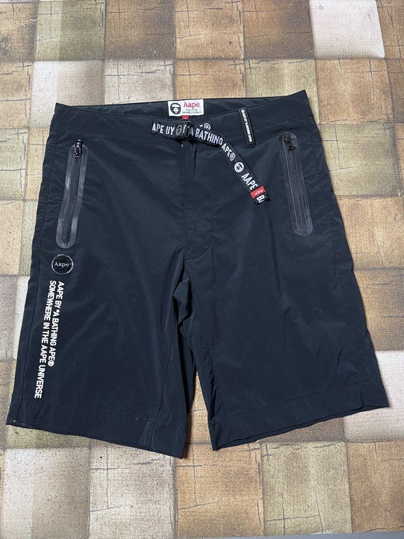 AAPE BY A BATHING APE® Shorts Black Size S (Category: Shorts) located in Manila. Submitted by noahcastilljos363 (Listing ID 1459954958, Image 1). Description: - Brand: AAPE - Color: Black - Size: S - Features iconic ape head logo - Skull graphic on the back - Includes AAPE branded belt - Front zipper pockets - Ideal for casual wear.