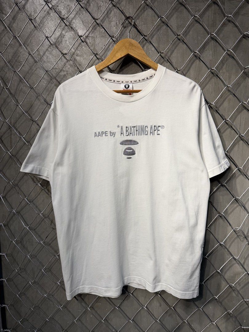 Aape General White Tee. (Category: Tshirts & Polo Shirts ) located in Manila. Submitted by ardobe.mnl (Listing ID 1460087002, Image 2). Description: Aape White Tee. Size: Medium Dimes: 21x27.5 Condition: Excellent (9/10) Flaw: Minimal tuldok tuldok sa print Dm for details or any inquiries! 🛒📥.