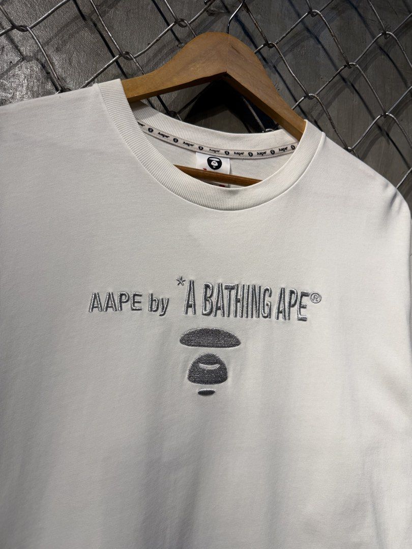 Aape General White Tee. (Category: Tshirts & Polo Shirts ) located in Manila. Submitted by ardobe.mnl (Listing ID 1460087002, Image 3). Description: Aape White Tee. Size: Medium Dimes: 21x27.5 Condition: Excellent (9/10) Flaw: Minimal tuldok tuldok sa print Dm for details or any inquiries! 🛒📥.
