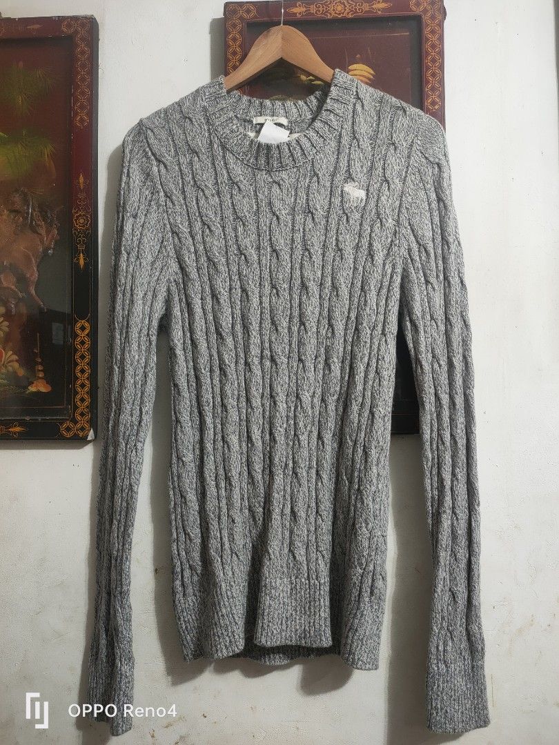 Abercrombie & Fitch Grey Cable Knit Sweater (Category: Coats, Jackets and Outerwear) located in Manila. Submitted by fiercehorse-60ca (Listing ID 1460052447, Image 1). Description: - Grey cable knit sweater - Brand: Abercrombie & Fitch - Size: Medium to xlarge - Material: 95% Cotton, 5% Wool - Perfect for cooler weather - Classic, versatile design for layering.
