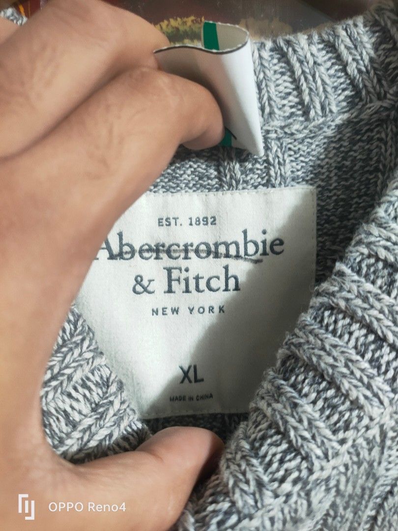 Abercrombie & Fitch Grey Cable Knit Sweater (Category: Coats, Jackets and Outerwear) located in Manila. Submitted by fiercehorse-60ca (Listing ID 1460052447, Image 3). Description: - Grey cable knit sweater - Brand: Abercrombie & Fitch - Size: Medium to xlarge - Material: 95% Cotton, 5% Wool - Perfect for cooler weather - Classic, versatile design for layering.