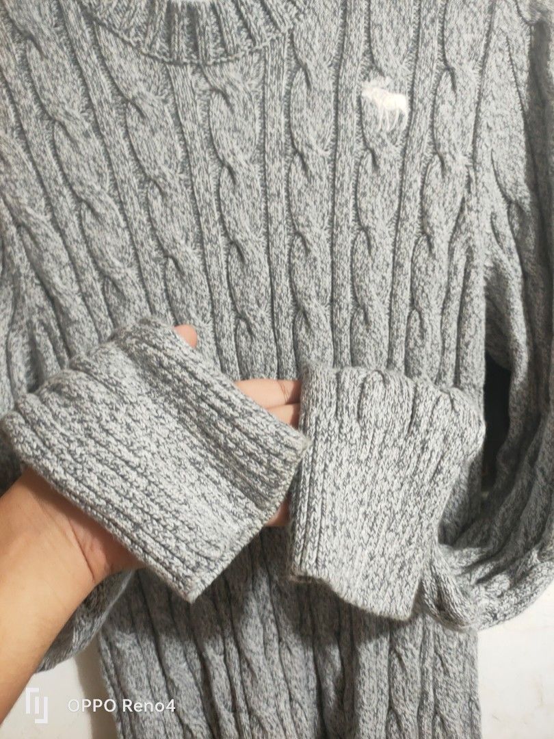 Abercrombie & Fitch Grey Cable Knit Sweater (Category: Coats, Jackets and Outerwear) located in Manila. Submitted by fiercehorse-60ca (Listing ID 1460052447, Image 2). Description: - Grey cable knit sweater - Brand: Abercrombie & Fitch - Size: Medium to xlarge - Material: 95% Cotton, 5% Wool - Perfect for cooler weather - Classic, versatile design for layering.