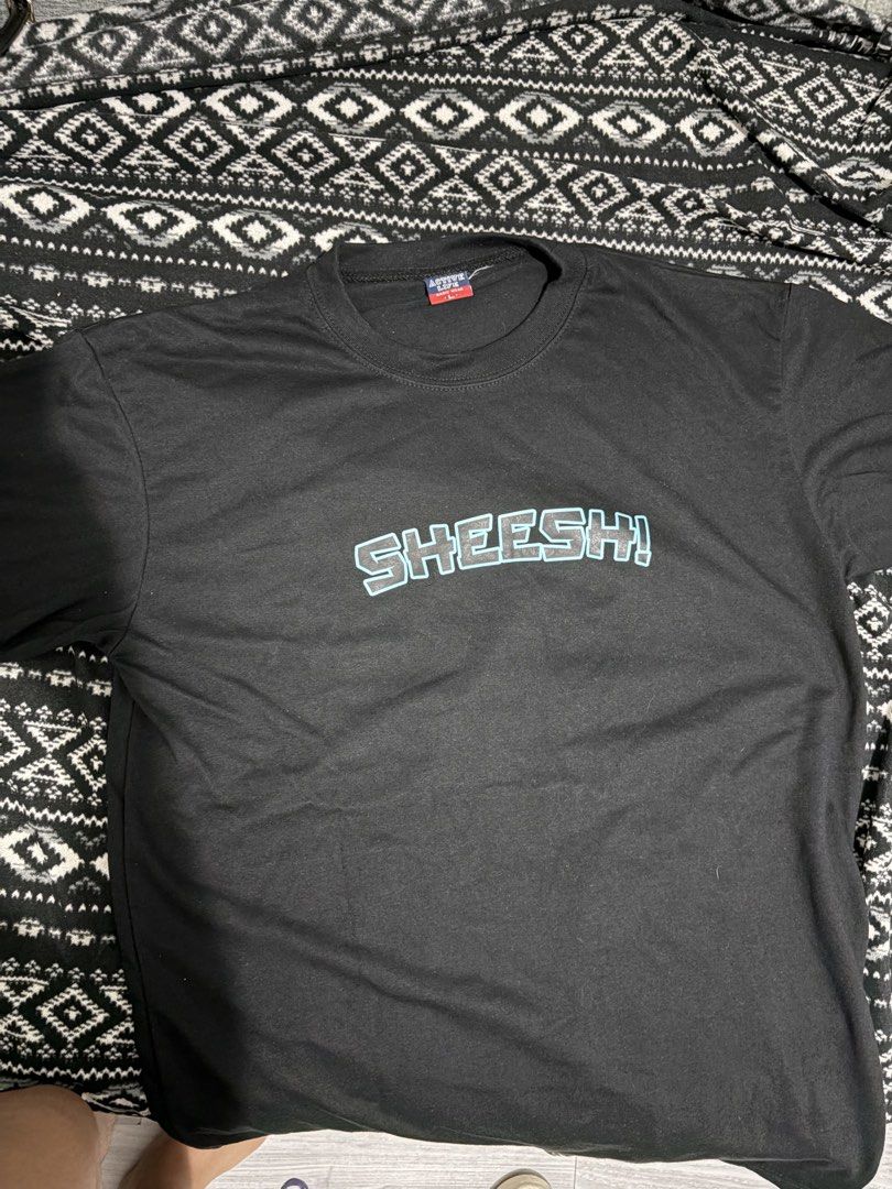 Active Life Basic Wear Black T-shirt "SHEESH!" Graphic Tee (Category: Tshirts & Polo Shirts ) located in Manila. Submitted by happytiger-d966 (Listing ID 1460048343, Image 1). Description: - Brand: Active Life Basic Wear - Color: Black - Graphic Print: "SHEESH!" - Size: Large (L) - Style: Casual wear - Condition: Please check photos for details.