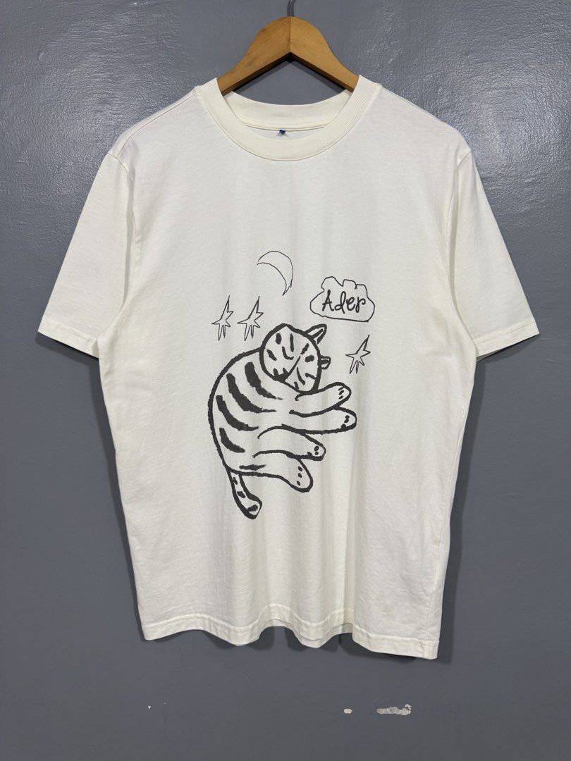 Ader Error - Sleeping Cat Doodle Shirt (Category: Tshirts & Polo Shirts ) located in Manila. Submitted by sophisticatedgoons (Listing ID 1459938848, Image 1). Description: Ader Error Sleeping Cat Doodle Art Tee Size: Large Dimes: 21 x 28 Very good condition No issue Check pics for details.