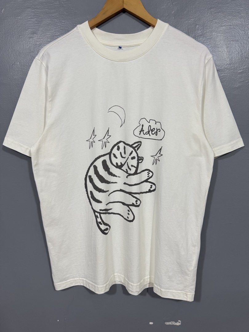 Ader Error - Sleeping Cat Doodle Shirt (Category: Tshirts & Polo Shirts ) located in Manila. Submitted by sophisticatedgoons (Listing ID 1459938848, Image 3). Description: Ader Error Sleeping Cat Doodle Art Tee Size: Large Dimes: 21 x 28 Very good condition No issue Check pics for details.