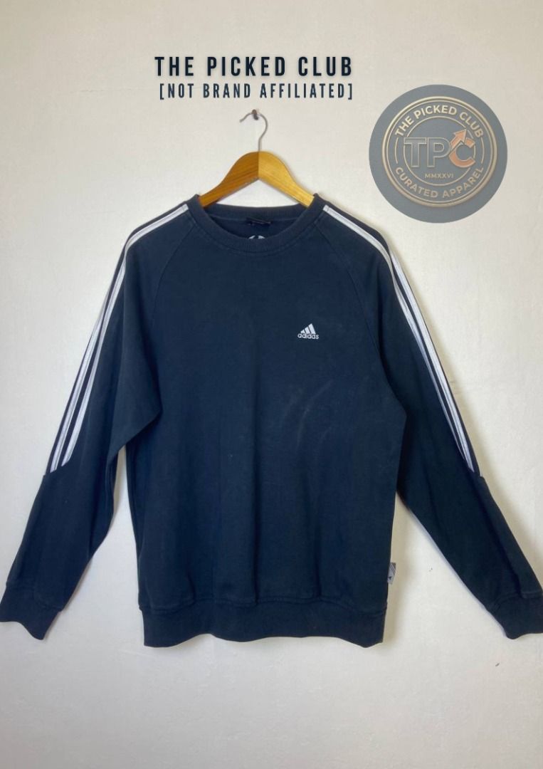 Adidas Black Sweatshirt with White Stripes (Category: Coats, Jackets and Outerwear) located in Imus. Submitted by thepickedclub (Listing ID 1460004503, Image 1). Description: xxxl (25x228) - Classic black Adidas sweatshirt - Features iconic white three stripes on sleeves - Simple and comfortable crewneck design - Perfect for casual wear or layering - Shows minor signs of wear, good overall condition - Versatile addition to any wardrobe.