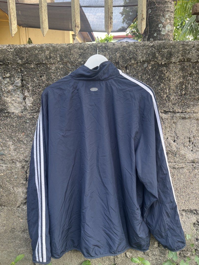 Adidas Clima365 Track Jacket Navy Blue (Category: Coats, Jackets and Outerwear) located in Manila. Submitted by christian048 (Listing ID 1460072897, Image 3). Description: - Navy blue Adidas track jacket - Size: L - Classic three stripes on sleeves - Full zip closure - Stand-up collar - Material: Polyester - Ideal for sports or casual wear.