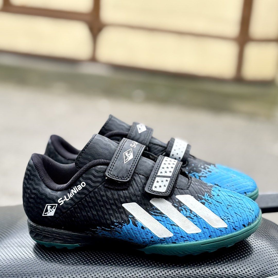 Adidas Inspired Soccer (Category: Babies & Kids Fashion) located in San Fernando. Submitted by kickslocker (Listing ID 1460048369, Image 2). Description: - Adidas-inspired soccer cleats - Color: Black with blue and white accents - Features: Velcro straps for easy on and off - Sole: Bright blue with good grip - Size: 34 Euro / 22cm - Ideal for: Indoor or turf play - Price: PHP 349.