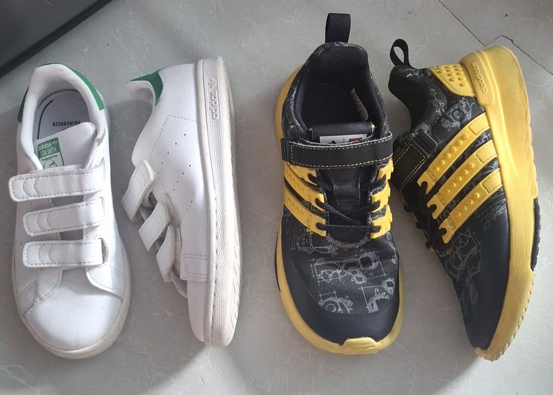 Adidas Stan Smith & LEGO Shoes Bundle (Kids) (Category: Babies & Kids Fashion) located in Pasay City. Submitted by al1son18 (Listing ID 1459938388, Image 1). Description: - Bundle of 2 pairs of kids' Adidas shoes - Includes white velcro Stan Smiths with green accents - Includes black and yellow LEGO-themed sneakers with velcro and laces - Perfect for active kids - Shows some signs of wear, but still has lots of life left -19cm .