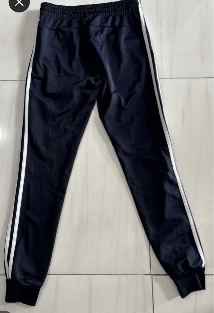 Adidas track pants NAVY BLUE SMALL (Category: Joggers) located in Quezon City. Submitted by edether (Listing ID 1460015373, Image 2). Description: - Navy blue Adidas track pants - Classic white stripes down the sides - Elastic waistband with drawstring - Jogger style with cuffed ankles - Ideal for sports or casual wear Like new condition Waist - 28-30in Length- 37in If you see it posted, it’s available. Last price and details are posted. No reply