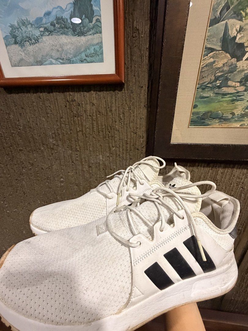 Adidas White Sneakers (Category: Casual Shoes) located in Manila. Submitted by cosmicriver-f451 (Listing ID 1459996915, Image 2). Description: - Classic white Adidas sneakers - Features iconic three stripes on the side - Perfect for everyday wear - Minor signs of use on soles and edges - Plenty of wear left, great bargain! - Negotiable .