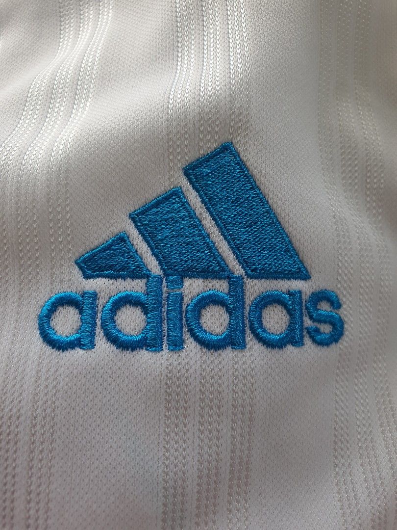 Adidas White Track Jacket with Blue, Red, White Stripes (Category: Activewear) located in Laoag. Submitted by soukay (Listing ID 1459982006, Image 3). Description: Manual Measurements: Pit to Pit : 48 inches Shoulder : 18 inches Length : 28.5 inches - Classic white Adidastrack jacket - Embroidered Adidas logo on chest - Large Adidas logo graphic on back - Blue, red, and white stripes down sleeves - Full front zipper closure - Two convenient side 