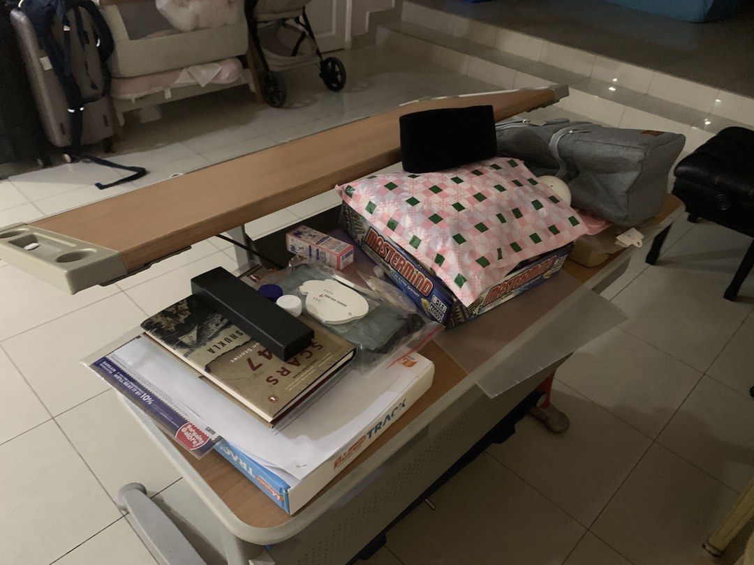 Adjustable Drafting Table (Category: Tables & Sets) located in Singapore. Submitted by vintage_antiques_c (Listing ID 1460054585, Image 3). Description: - Wooden top drafting table - Adjustable height and angle - Ruler guide along the top edge - Pink and grey legs - Storage compartment underneath - Suitable for drawing, art, or study.