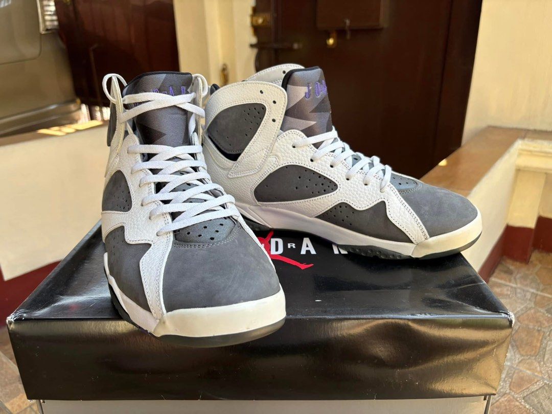 Air Jordan 7 Retro "Flint" (Category: Sneakers) located in Caloocan City. Submitted by wildtiger.29bf8a (Listing ID 1460043877, Image 1). Description: - Authentic Air Jordan 7 Retro "Flint" - Classic Grey and White colorway - Stylish high-top silhouette - Includes original box - Ideal for sneaker collectors and enthusiasts.