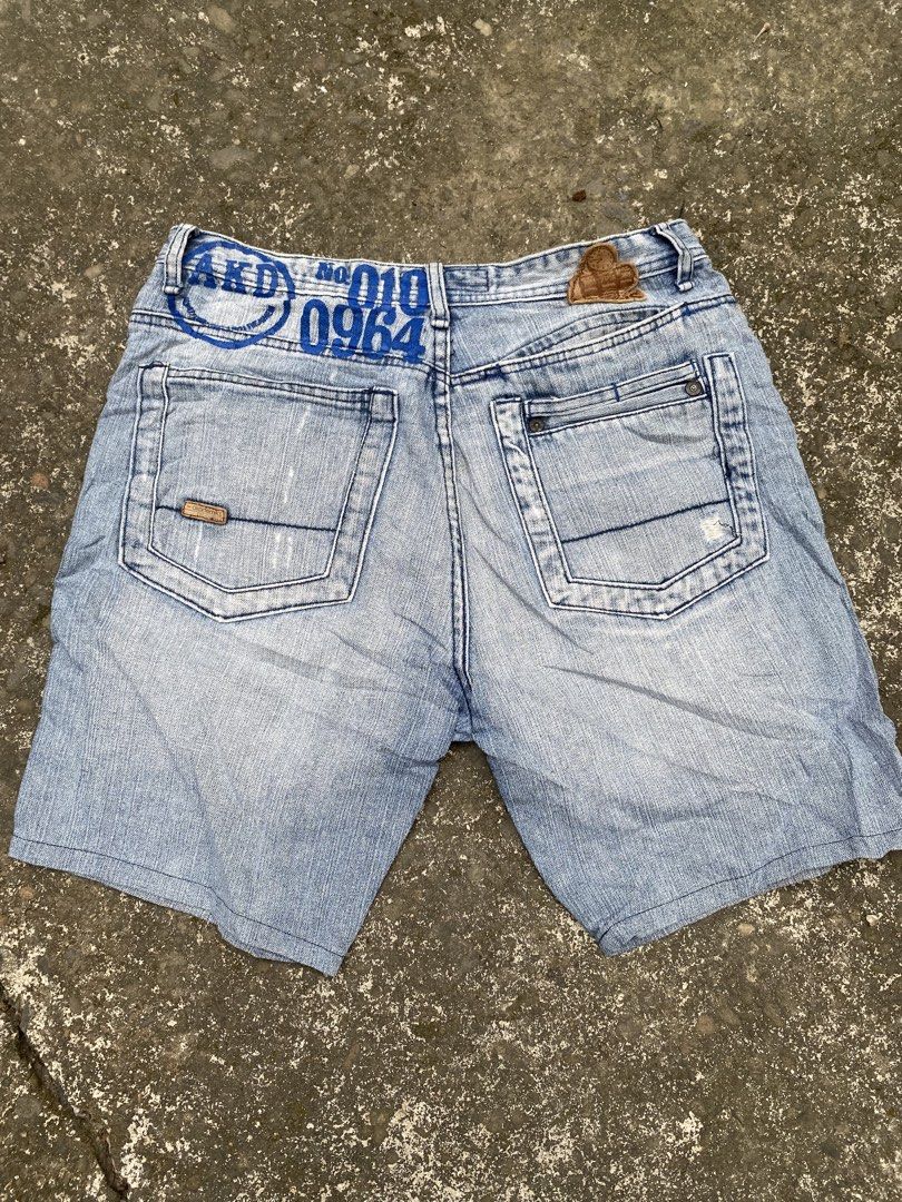 Akademiks Light Wash Denim Shorts (Category: Shorts) located in Escalante. Submitted by relicofthenorth.082630 (Listing ID 1459932255, Image 2). Description: - Brand: Akademiks - Color: Light Wash Denim - Size: 32 - Features: Distressed details (front & back), signature logo on back pocket and waistband - Closure: Button fly - Style: Casual wear.