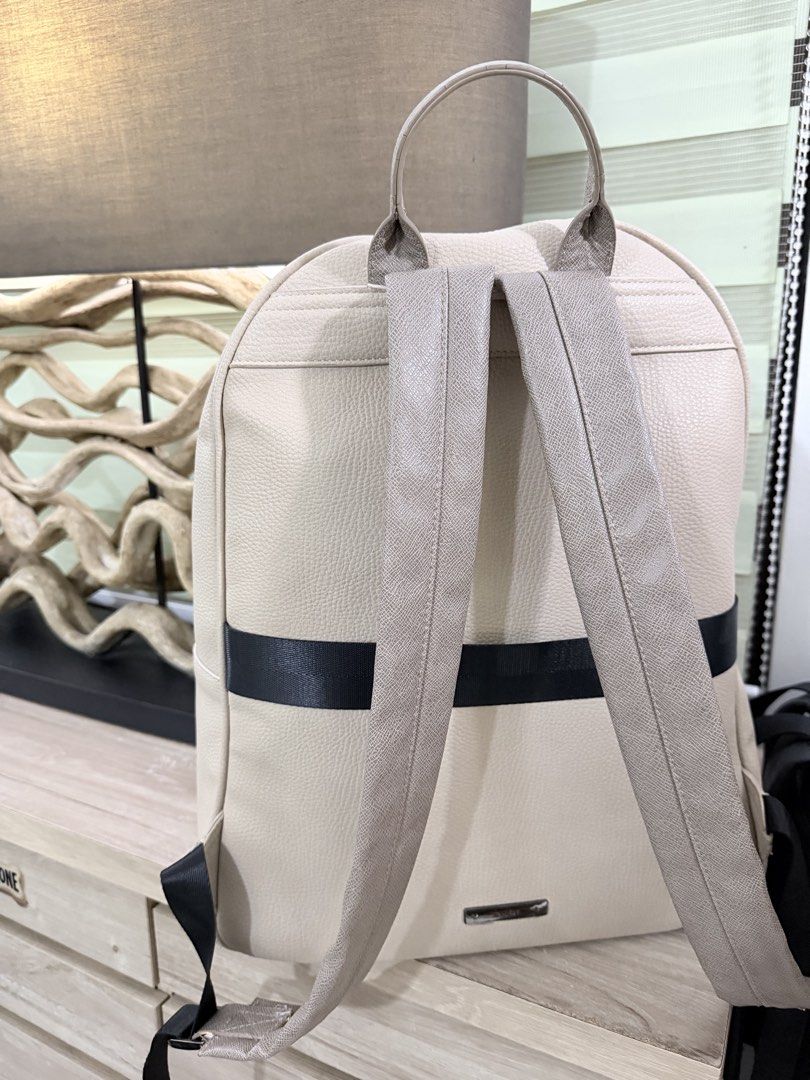 ALDO Tristian Beige Men Backpack (Category: Backpacks) located in Pasig City. Submitted by iambernabe (Listing ID 1460039217, Image 3). Description: - Elegant beige and taupe colorblock design - Convenient front pocket with flap closure - Adjustable straps for a comfortable fit - Spacious main compartment with zipper closure - Ideal for everyday errands or your next getaway.