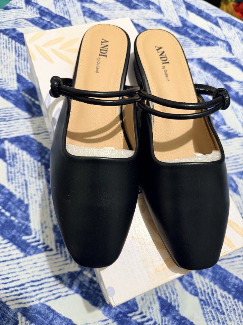 ANDI by Outland Black Knot Strap Mules (Category: Flats & Sandals) located in Muntinlupa City. Submitted by jaja.0903 (Listing ID 1460003513, Image 1). Description: - Brand: ANDI by Outland - Color: Black - Style: Mules - Features: Knot strap detail, square toe, low block heel - Closure: Slip-on - Includes: Original box.