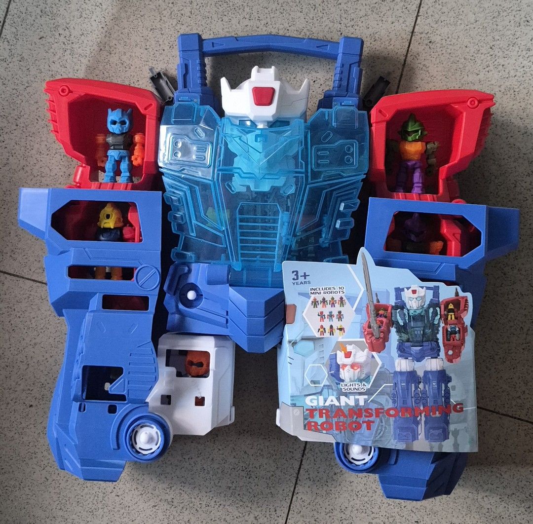 ANKO Giant Transforming Robot Toy with 10 Mini Figures (Category: Action & Battle Toys) located in Tagaytay City. Submitted by gracey332 (Listing ID 1459976578, Image 1). Description: - Large transforming robot toy - Includes several mini figures that fit inside - Features blue and red parts with clear blue accents - Two robots are still in original packaging (sealed) - Ideal for kids who love robots and action figures - Encourages imaginative an