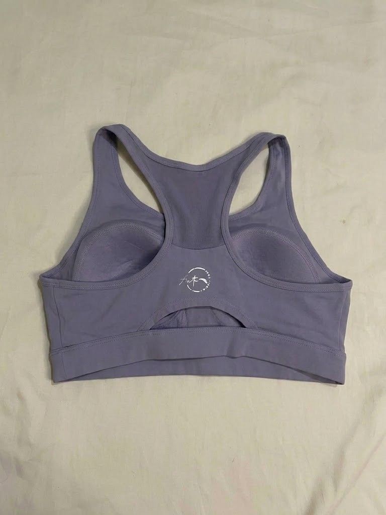ANTA Lavender Sports Bra (Category: Activewear) located in Binan City. Submitted by declutterbyjwy (Listing ID 1459987273, Image 2). Description: bust: 34-36" | length: 11" - size m but it runs small; it fits an xs-semi m - good as new, never used & no flaws - mesh panel at neckline, racerback style.
