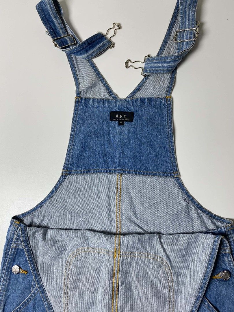 APC DENIM OVERALL (Category: Jumpsuits) located in Balanga. Submitted by dig_gear (Listing ID 1459940010, Image 3). Description: APC DENIM OVERALL This mid-weight A.P.C. denim overall features a classic medium-blue wash with a relaxed, straight-leg silhouette. It includes standard adjustable suspender straps, a signature curved stitch bib pocket, classic five-pocket styling, and branded silver-tone button closures along the waist. MADE IN TUNISIA