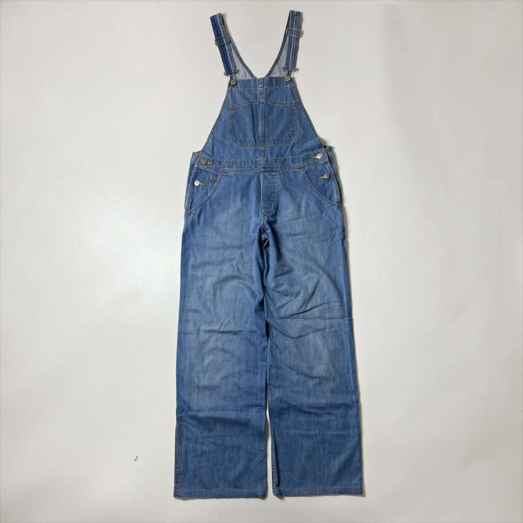 APC DENIM OVERALL (Category: Jumpsuits) located in Balanga. Submitted by dig_gear (Listing ID 1459940010, Image 1). Description: APC DENIM OVERALL This mid-weight A.P.C. denim overall features a classic medium-blue wash with a relaxed, straight-leg silhouette. It includes standard adjustable suspender straps, a signature curved stitch bib pocket, classic five-pocket styling, and branded silver-tone button closures along the waist. MADE IN TUNISIA