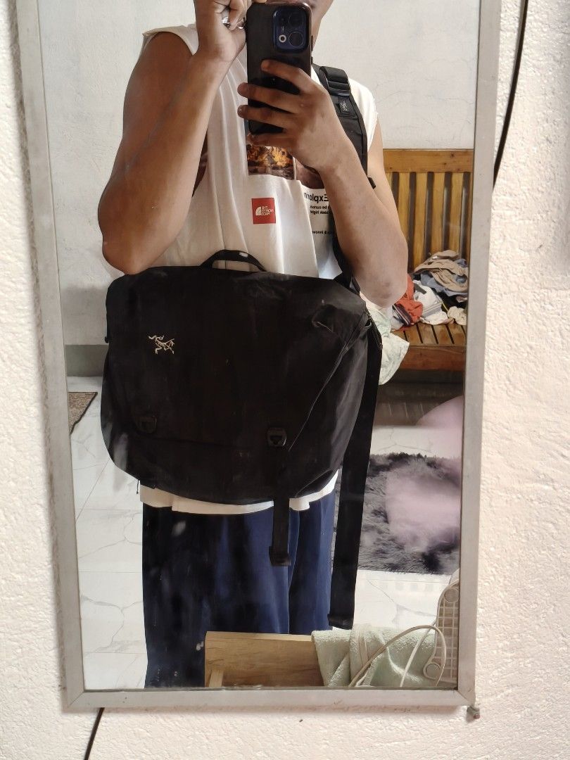 Arc'teryx Messenger Bag (Category: Sling Bags) located in Siquijor. Submitted by retrothreads-r18 (Listing ID 1459912592, Image 2). Description: - Arc'teryx messenger bag - Color: Dark Grey - Features adjustable strap with buckle closure - Note: Some wear on the strap as pictured - Ideal for everyday use.