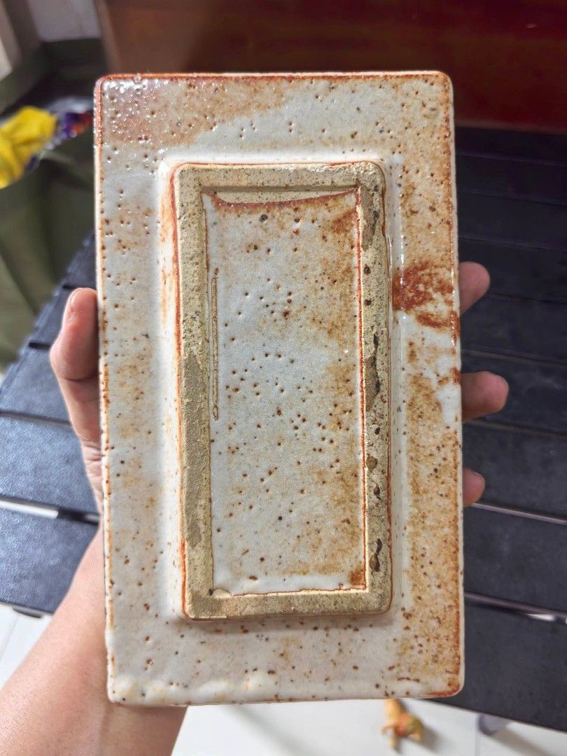 Ashtray - Rectangular Stoneware Ashtray (Category: Vases & Decorative Bowls) located in Cebu City. Submitted by dudes_villanueva (Listing ID 1459940245, Image 3). Description: Ashtray - Rectangular Stoneware Ashtray 📌 Speckled Beige Finish and a vibrant green-and-blue melted glass center. 📌 Material: Speckled stoneware body with a crystallized glass glaze in the middle. 📌 Design: Rectangular shape with built-in cigarette rests on both ends. 📌