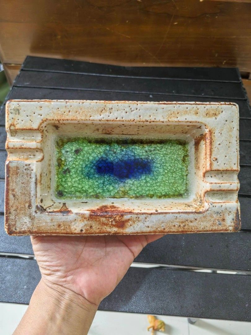 Ashtray - Rectangular Stoneware Ashtray (Category: Vases & Decorative Bowls) located in Cebu City. Submitted by dudes_villanueva (Listing ID 1459940245, Image 2). Description: Ashtray - Rectangular Stoneware Ashtray 📌 Speckled Beige Finish and a vibrant green-and-blue melted glass center. 📌 Material: Speckled stoneware body with a crystallized glass glaze in the middle. 📌 Design: Rectangular shape with built-in cigarette rests on both ends. 📌
