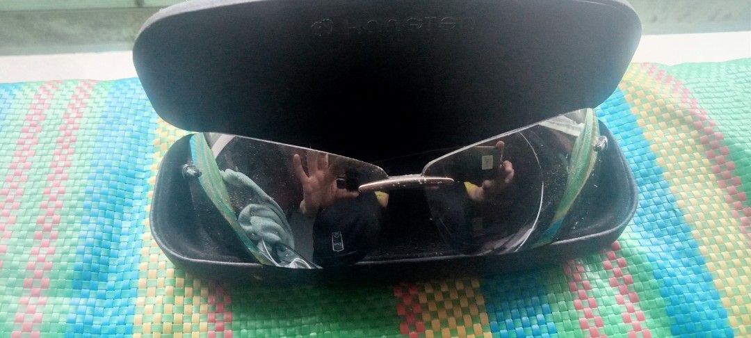 Assorted Sunglasses and Eyeglasses Bundle (Category: Sunglasses & Eyewear) located in Paranaque City. Submitted by dimaguilaa94969 (Listing ID 1460054216, Image 2). Description: - Bundle includes 4 pairs of eyewear. - Black framed sunglasses with side shields. - Rimless sunglasses with protective case. - Black framed eyeglasses. - Round wire-frame glasses. - All items are clearly shown in the provided photos..