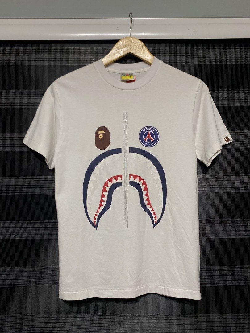 BAPE X PARIS GERMAIN SHIRT (Category: Tshirts & Polo Shirts ) located in Antipolo. Submitted by treasurethings02 (Listing ID 1460105458, Image 1). Description: BATHING APE X PARIS SAINT GERMAIN EXCELLENT CONDITION 9/10 CR DIMENSIONS 18W 25L SMALL MEN CHECK DETAILS ON PHOTO🫶🏻.