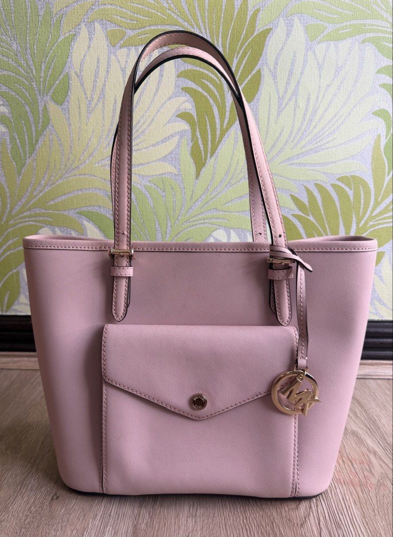 Authentic Michael Kors Leather Tote (Category: Tote Bags) located in Manila. Submitted by bagloverscloset (Listing ID 1459977750, Image 1). Description: Bargain Sale!!! Original MK tote for only P2,500!!! Authentic Michael Kors Jet Set Tote Item Code: 38H8GTTT6L Color: Blossom Material: Saffiano Leather Size: length 9”, base width 10”, opening width 13”, base 5.5” Bought in the U.S. Tag intact, never used. With flaws - scratches/chafing, discolor