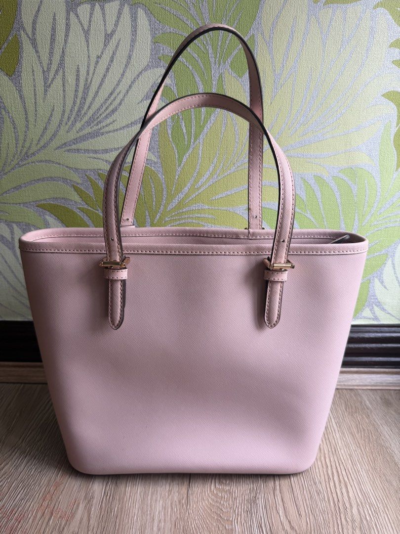Authentic Michael Kors Leather Tote (Category: Tote Bags) located in Manila. Submitted by bagloverscloset (Listing ID 1459977750, Image 2). Description: Bargain Sale!!! Original MK tote for only P2,500!!! Authentic Michael Kors Jet Set Tote Item Code: 38H8GTTT6L Color: Blossom Material: Saffiano Leather Size: length 9”, base width 10”, opening width 13”, base 5.5” Bought in the U.S. Tag intact, never used. With flaws - scratches/chafing, discolor
