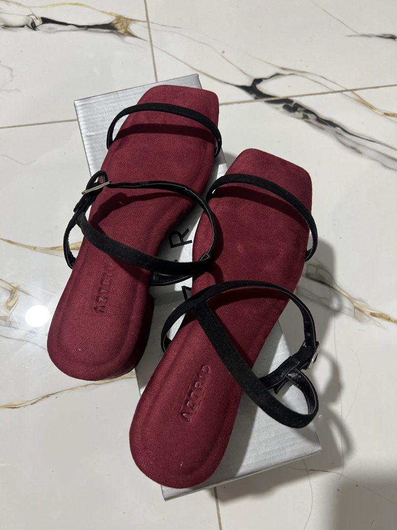 AZTRID Burgundy Flat Sandals with Black Straps (Category: Flats & Sandals) located in Taguig. Submitted by oceanwaves21 (Listing ID 1459974810, Image 1). Description: Rfs. Wrong size. - Brand: AZTRID - Color: Burgundy - Style: Flat sandals - Features: Thin black ankle straps with buckle closure, square toe - Occasion: Great for casual wear.