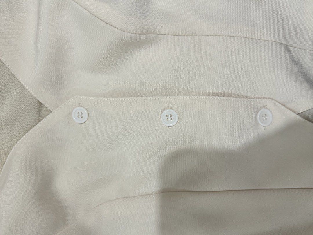 BACKLESS IVORY TOP (Category: Others Tops) located in Quezon City. Submitted by reirei.08 (Listing ID 1459925212, Image 3). Description: - Quality: Like new. Worn once. Complete buttons and garterized back - Smooth fabric with lining. Perfect for casual outings or beach top. - Ivory/Cream in actual. - RFS: Not my style anymore.