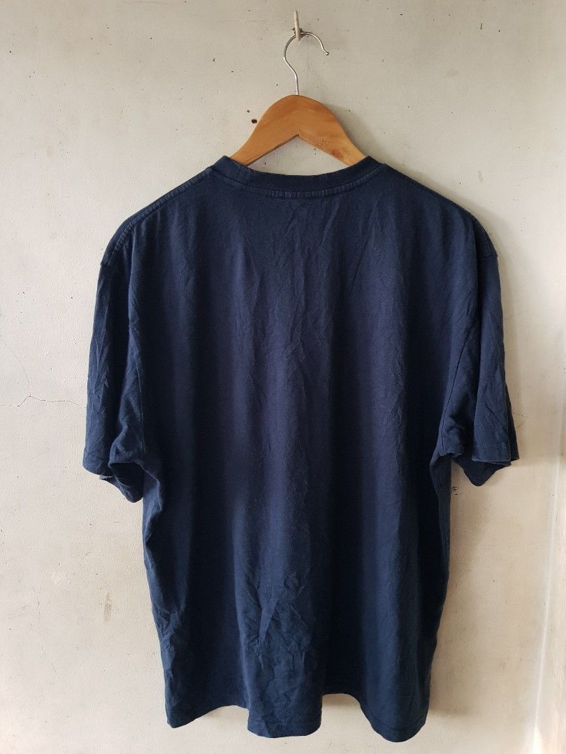 Balenciage Logo Tee T Shirt (Category: Luxury Apparel) located in Santo Domingo. Submitted by jcobedoza213916 (Listing ID 1459982811, Image 2). Description: balenciaga Logo Tee T Shirt Unisex Men's & Women's Width 22 lenght 27 Embroid Front Logo Balenciaga Est 1917 Made In Portugal color Navy Blue size on tag LARGE excellent condition color rate 9.6/10 necktag Cut Tag no issue: No Pinhole No Flaws No Discoloration.