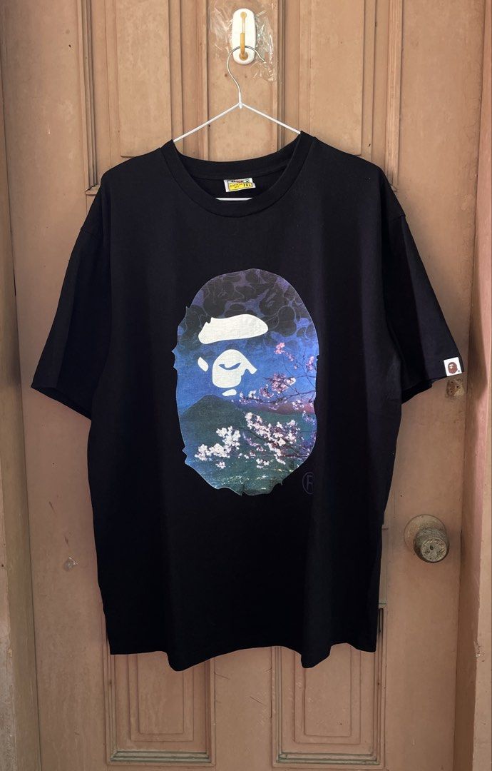 BAPE Sakura Tee (Category: Activewear) located in Liloy. Submitted by juan2thrift (Listing ID 1459916192, Image 1). Description: Bape Sakura Tee Size 2xl Color Rate - 10/10 24” by 30” Issue - Missing Gold Tag Single Stitch.
