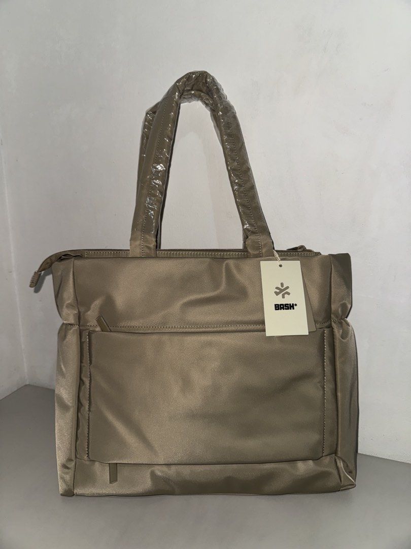 BASH Gateway Weekday Tote (Dune) (Category: Shoulder Bags) located in Muntinlupa City. Submitted by daisydosephh (Listing ID 1459972244, Image 3). Description: - Brand new BASH* padded nylon tote bag - Includes original dust bag - Handles still have protective plastic wrap - Multiple interior compartments for excellent organization - Ideal for everyday use or travel.