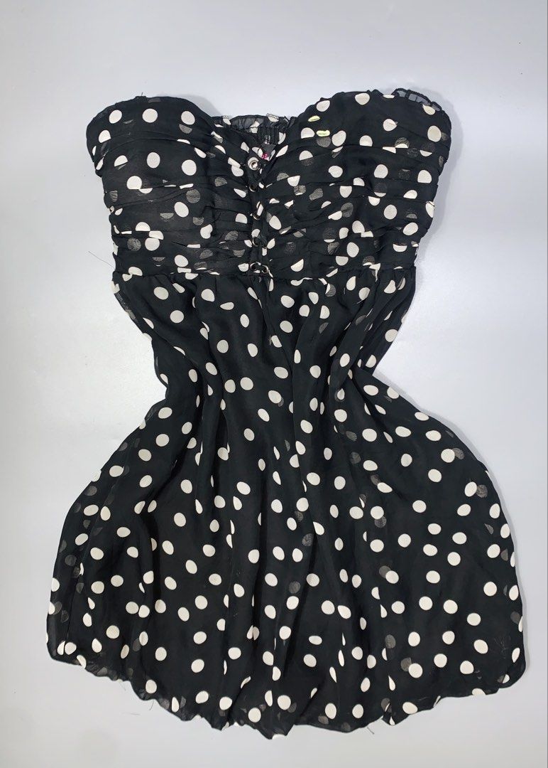 Bebe Black Polka Dot Strapless Mini Dress Size M (Category: Dresses) located in Dagupan City. Submitted by sj_styles0910. (Listing ID 1460096277, Image 1). Description: - Cute black strapless mini dress - White polka dot pattern - Smocked bust for a comfortable and secure fit - Flirty ruffled hemline - Ideal for night outs or parties - Versatile styling with heels or sandals.