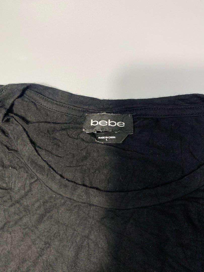 Bebe Black T-shirt with Rhinestone Logo (Category: Shirts) located in Dagupan City. Submitted by sj_styles0910. (Listing ID 1460096249, Image 3). Description: - Authentic Bebe tee with eye-catching rhinestone embellished logo. - Made from soft fabric for ultimate comfort. - Relaxed fit, ideal for everyday casual wear. - Effortlessly pairs with jeans, shorts, or skirts. - A timeless Bebe essential for your wardrobe..